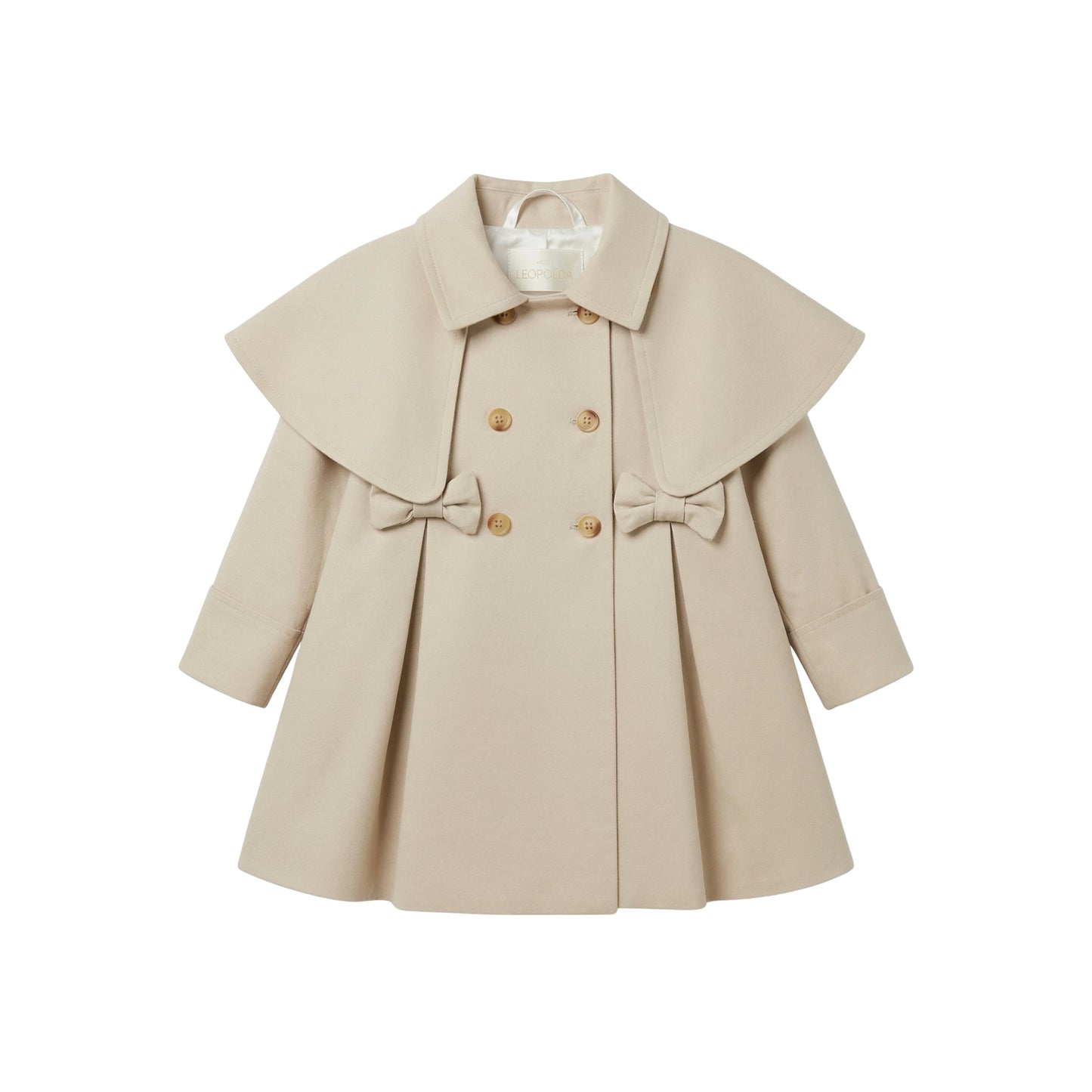 Maison Leopolda Alba Trench-Coat in beige with rounded shoulder cape, bow details, and wooden buttons - front view